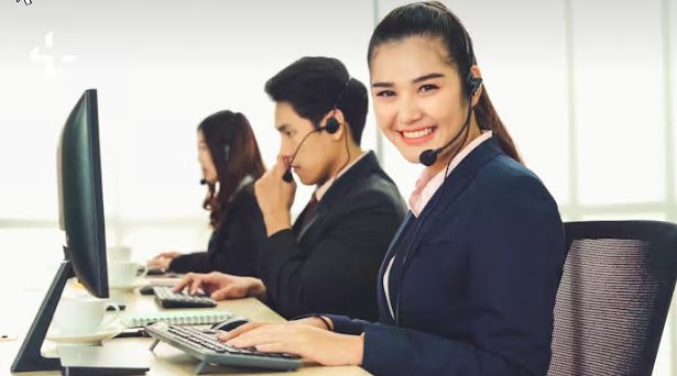Friendly technical support team at their desks